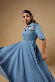Full-length twirl view of the Daisydrift Handkerchief Dress, highlighting its airy, flared hemline and breezy denim drape for effortless movement.