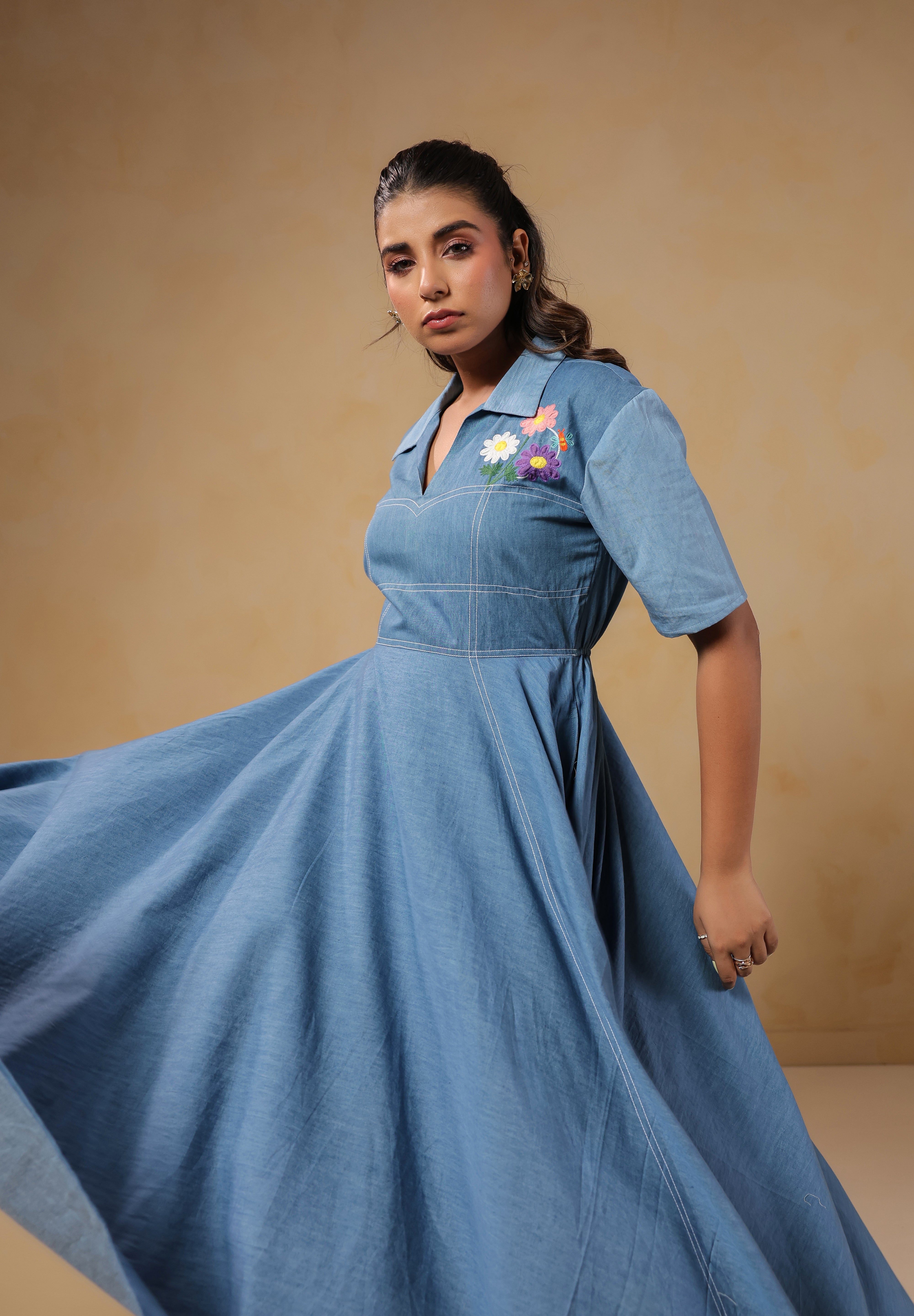 Full-length twirl view of the Daisydrift Handkerchief Dress, highlighting its airy, flared hemline and breezy denim drape for effortless movement.