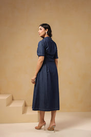 Back view of Aqua Prism Midi Dress, flared denim fit with mid-length sleeves
