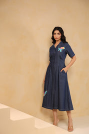 Close-up of bodice embroidery featuring turtle, bubbles, and flowers on Aqua Prism Midi Dress
