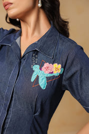 Close-up embroidery shot of turtle, florals, and bubbles on denim Aqua Prism Midi Dress