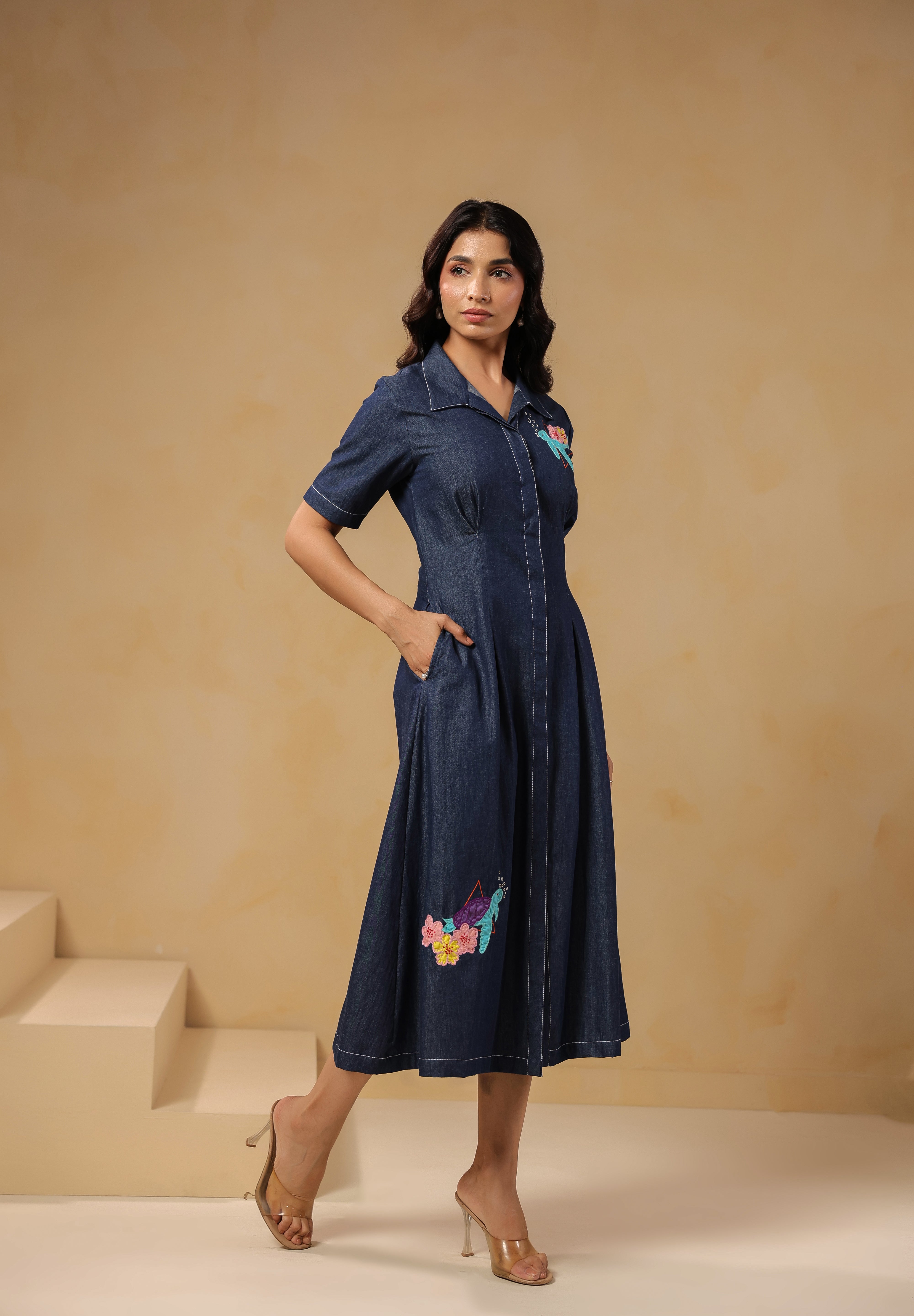 Detailed embroidery of turtle and flowers on lower skirt of Aqua Prism Midi Dress