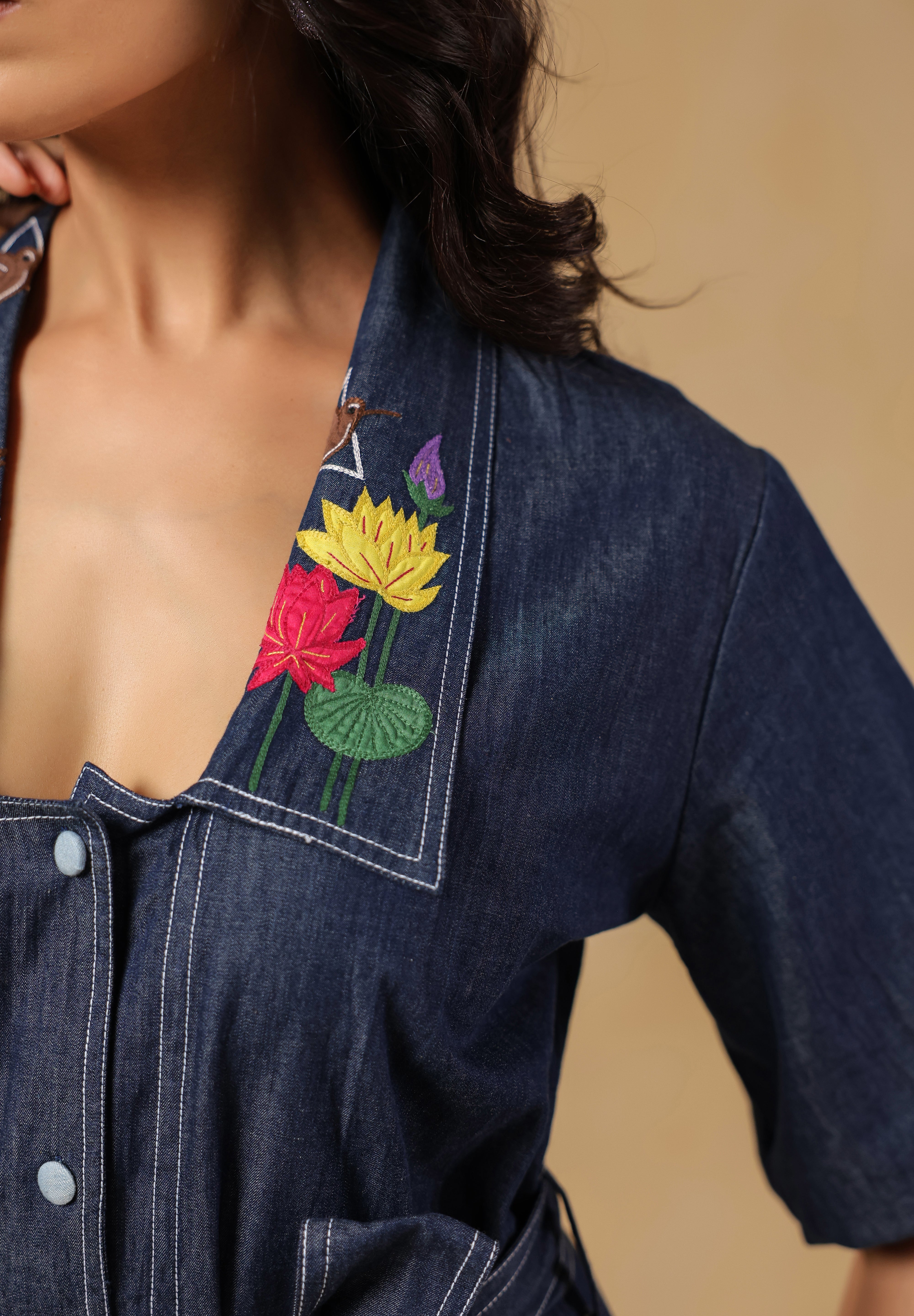 Closeup of bird embroidery on Aviary Belted Midi Dress