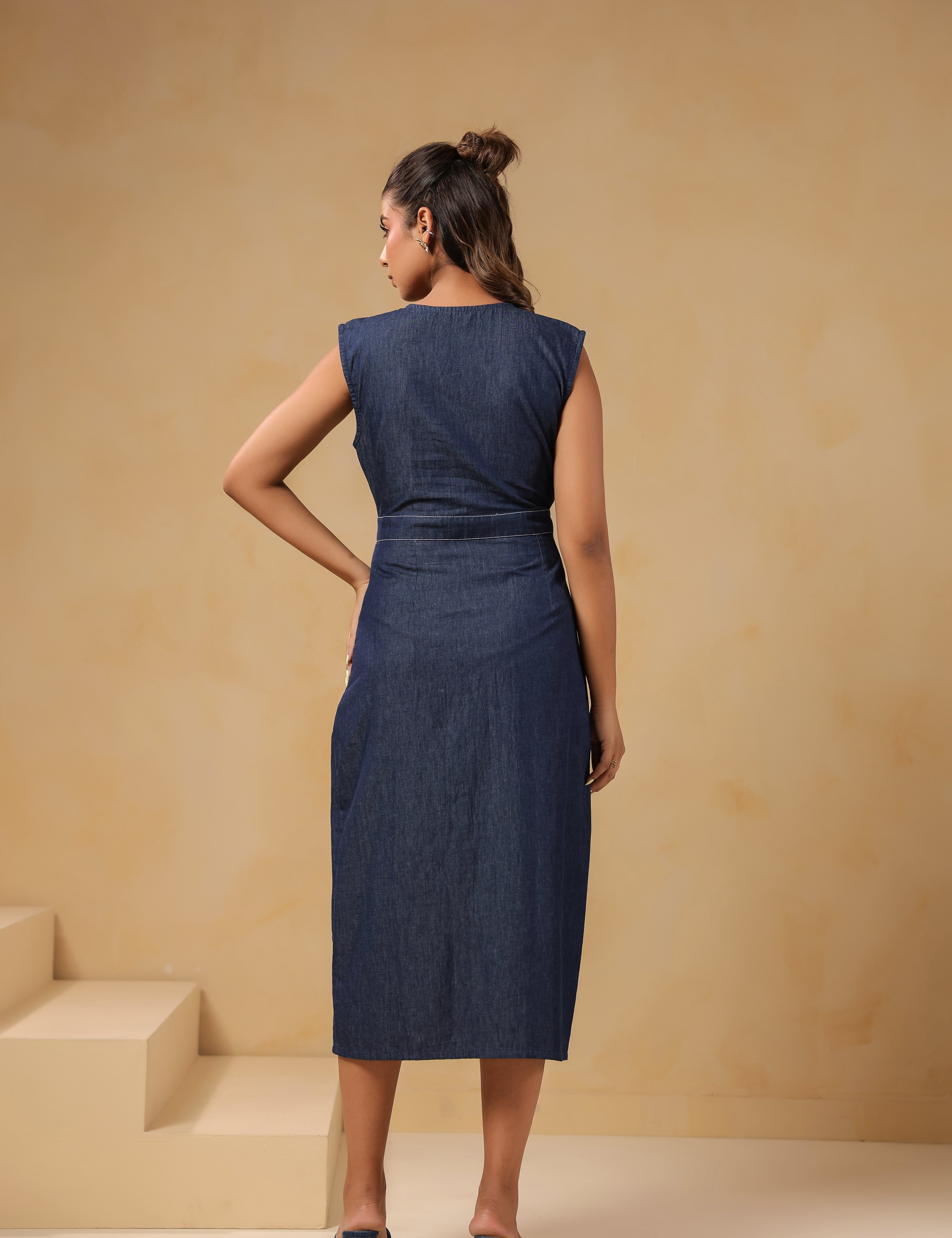 Back view of Bloom Trail Button Dress in breathable denim with floral hem embroidery