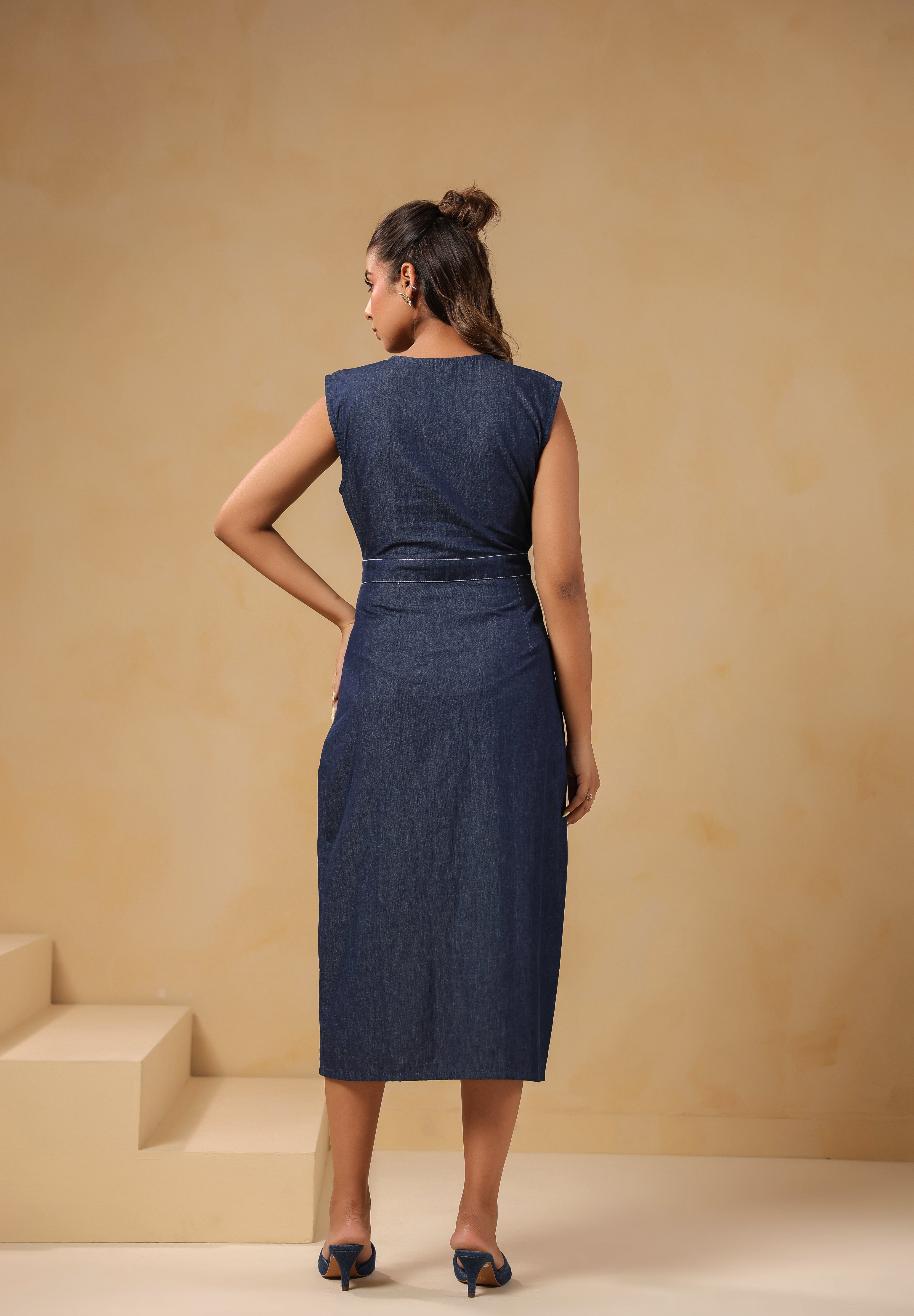 Back view of Bloom Trail Button Dress in breathable denim with floral hem embroidery