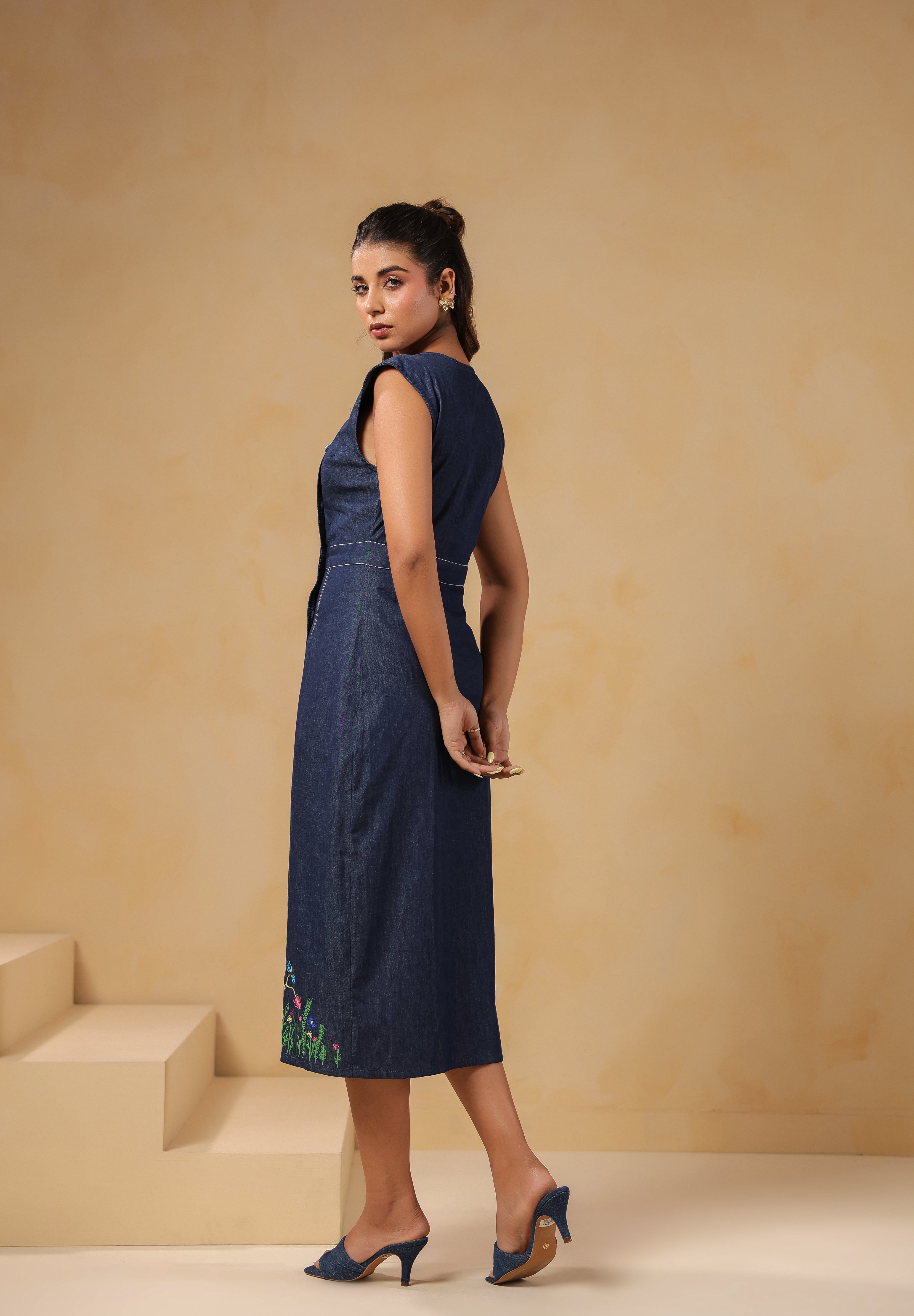 Side-back view of Bloom Trail Button Dress showing tailored fit and asymmetric button line
