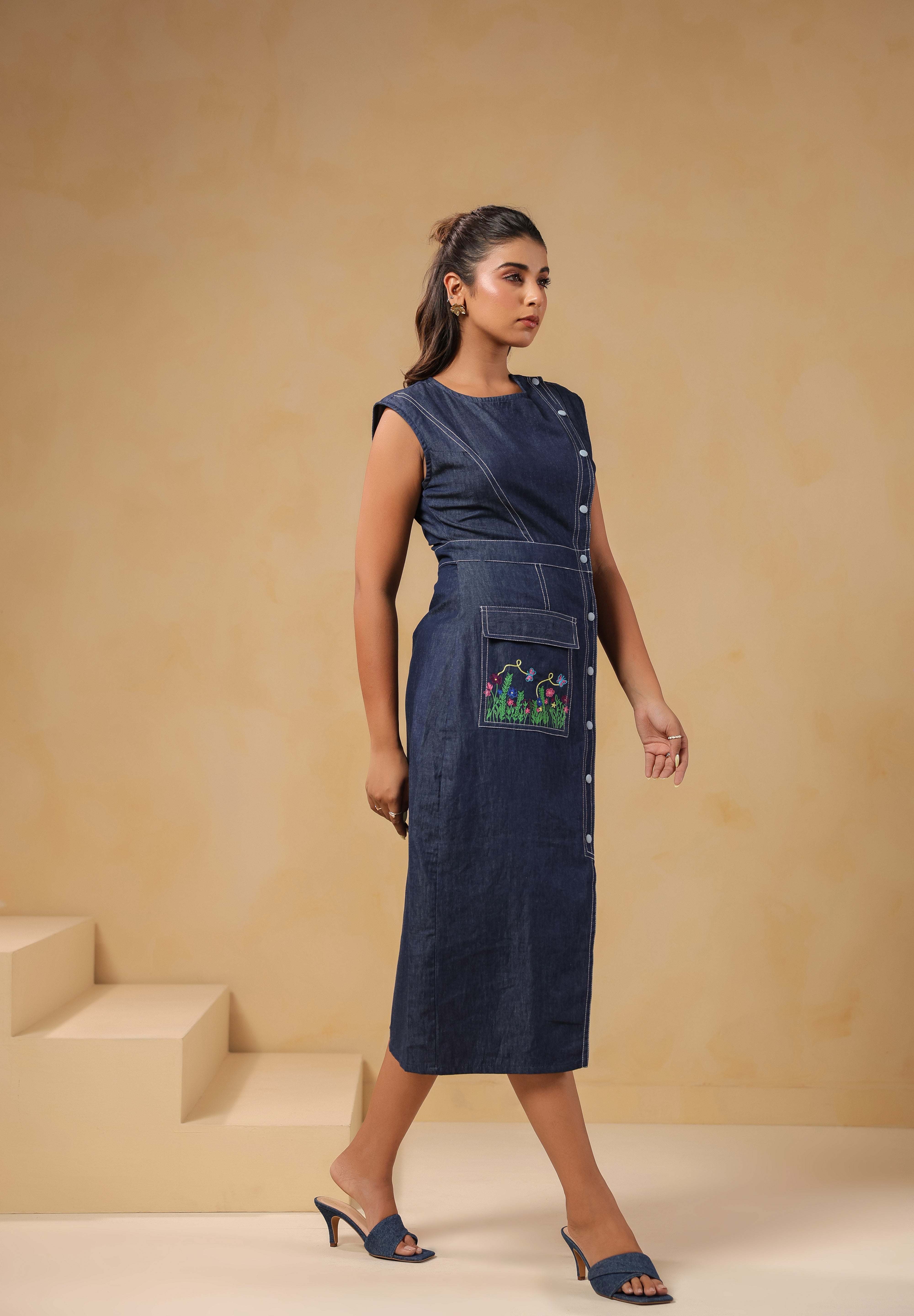 Side view of Bloom Trail Button Dress highlighting waistline fit and embroidered pocket