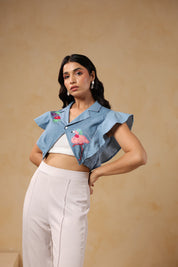 Fashion shoot pose highlighting Flaminglow Crop Top design