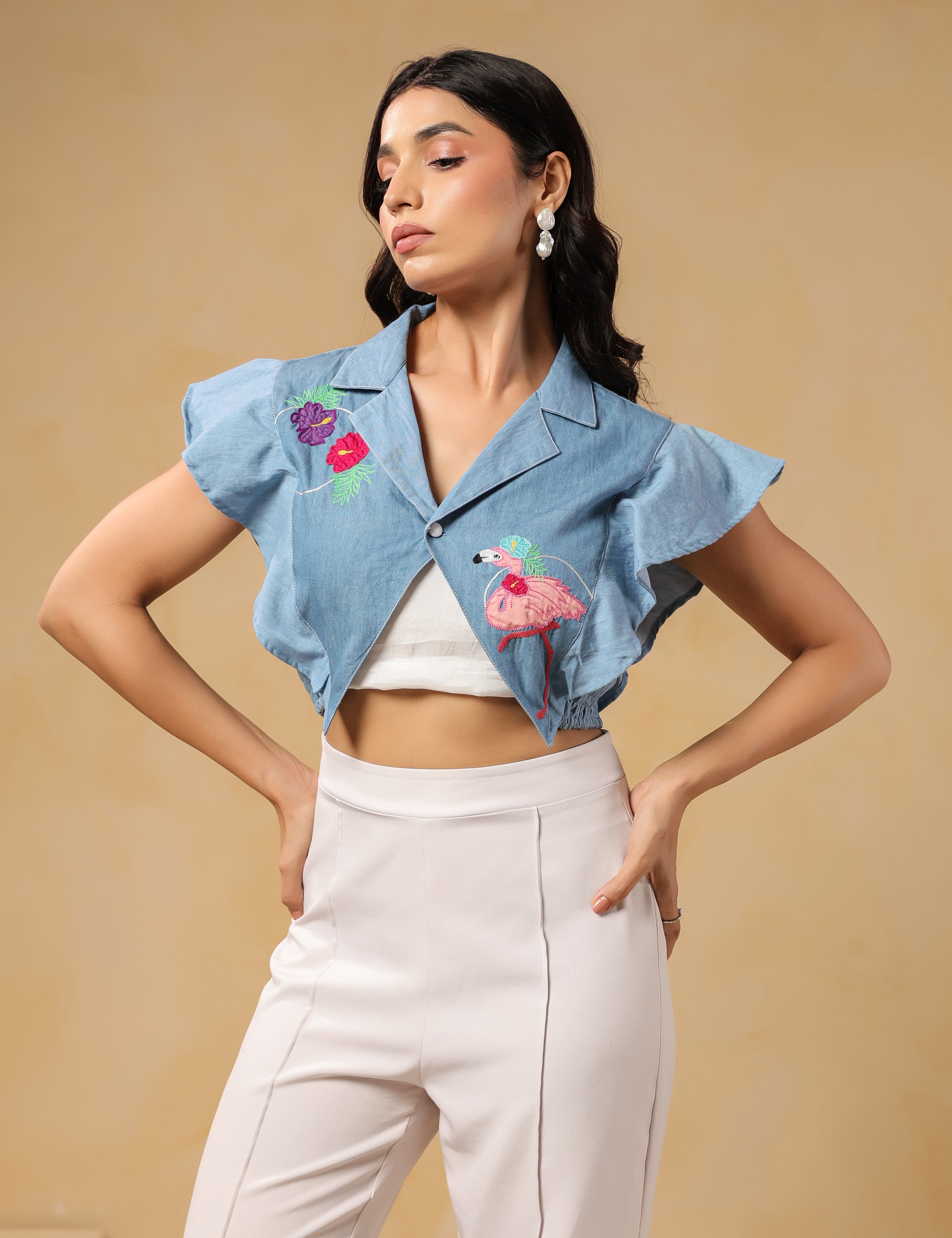 Side profile of Flaminglow Crop Top with tropical floral embroidery