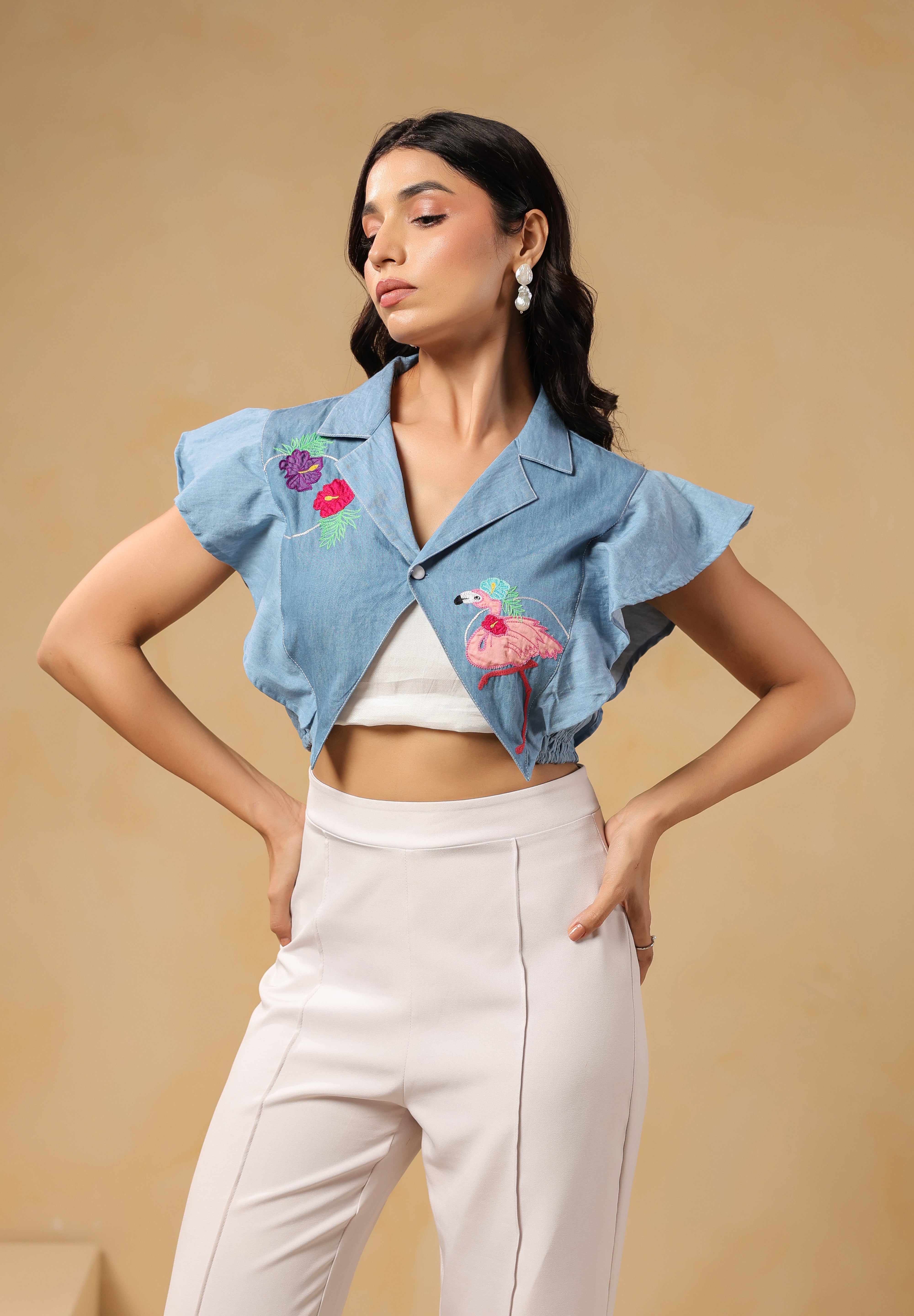 Side profile of Flaminglow Crop Top with tropical floral embroidery