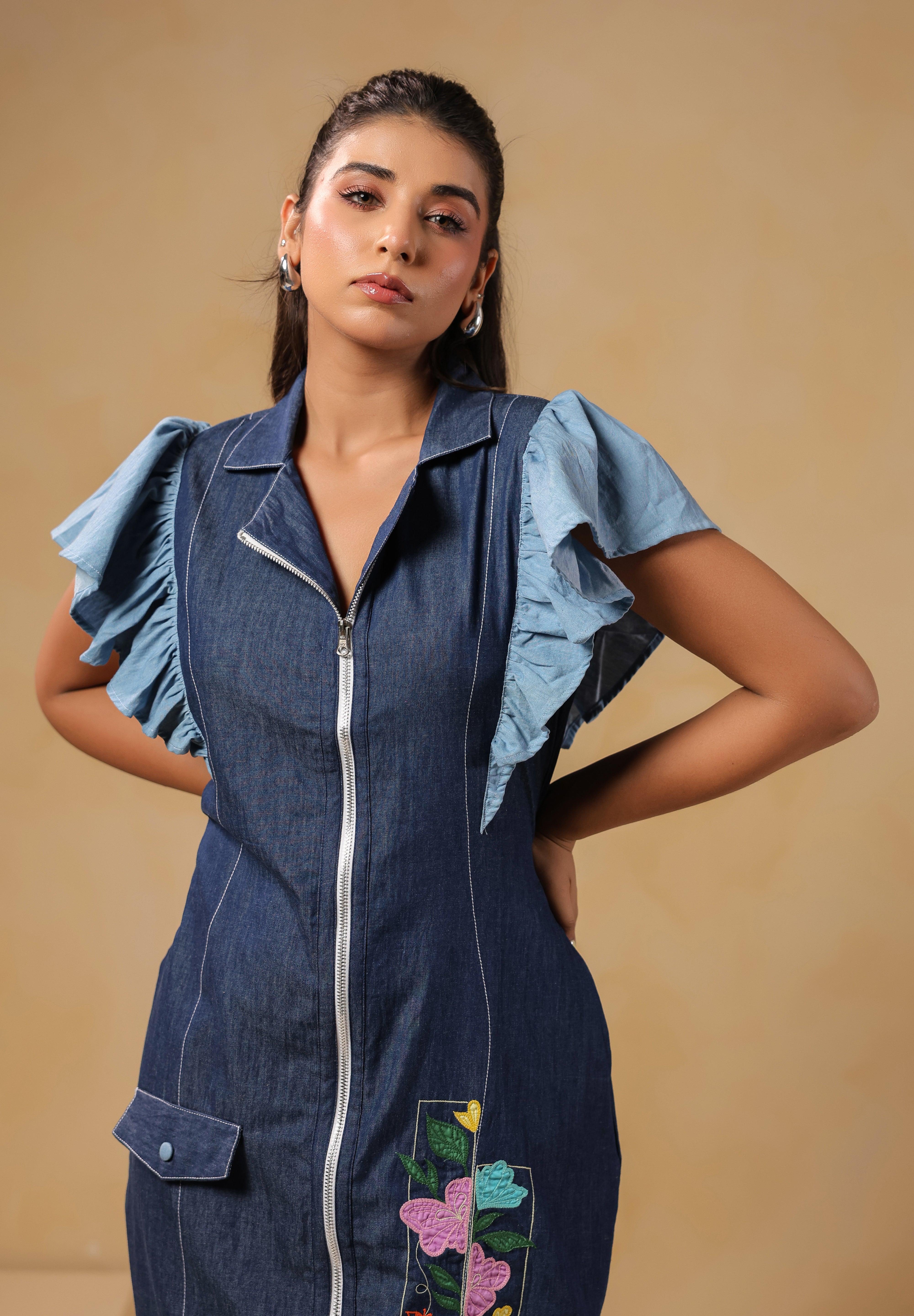 Close-up front shot of Florablock Zip Mini Dress displaying zipper fastening and statement ruffle sleeves