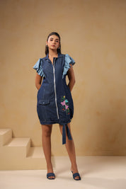 Full standing pose of the Florablock Zip Mini Dress styled with denim heels for an effortless day-to-evening look