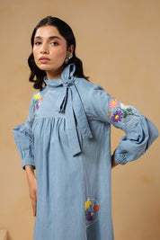 Detailed view of embroidered flowers and butterfly on sleeve of Floraverse Dress