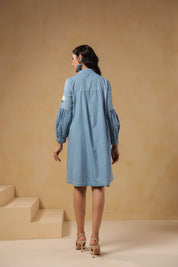 Back view of Floraverse Tie Neck Denim Dress with puff sleeves