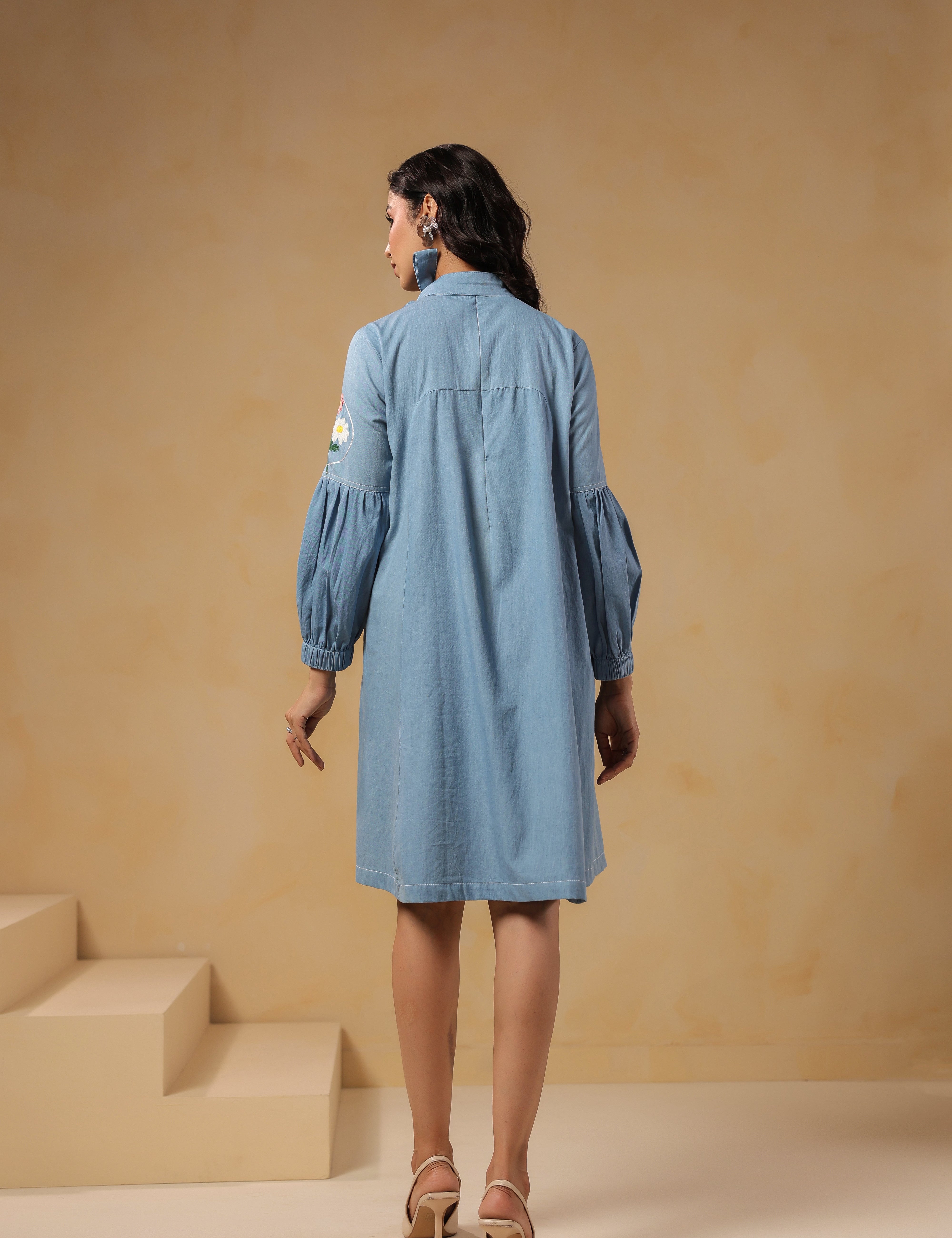 Back view of Floraverse Tie Neck Denim Dress with puff sleeves
