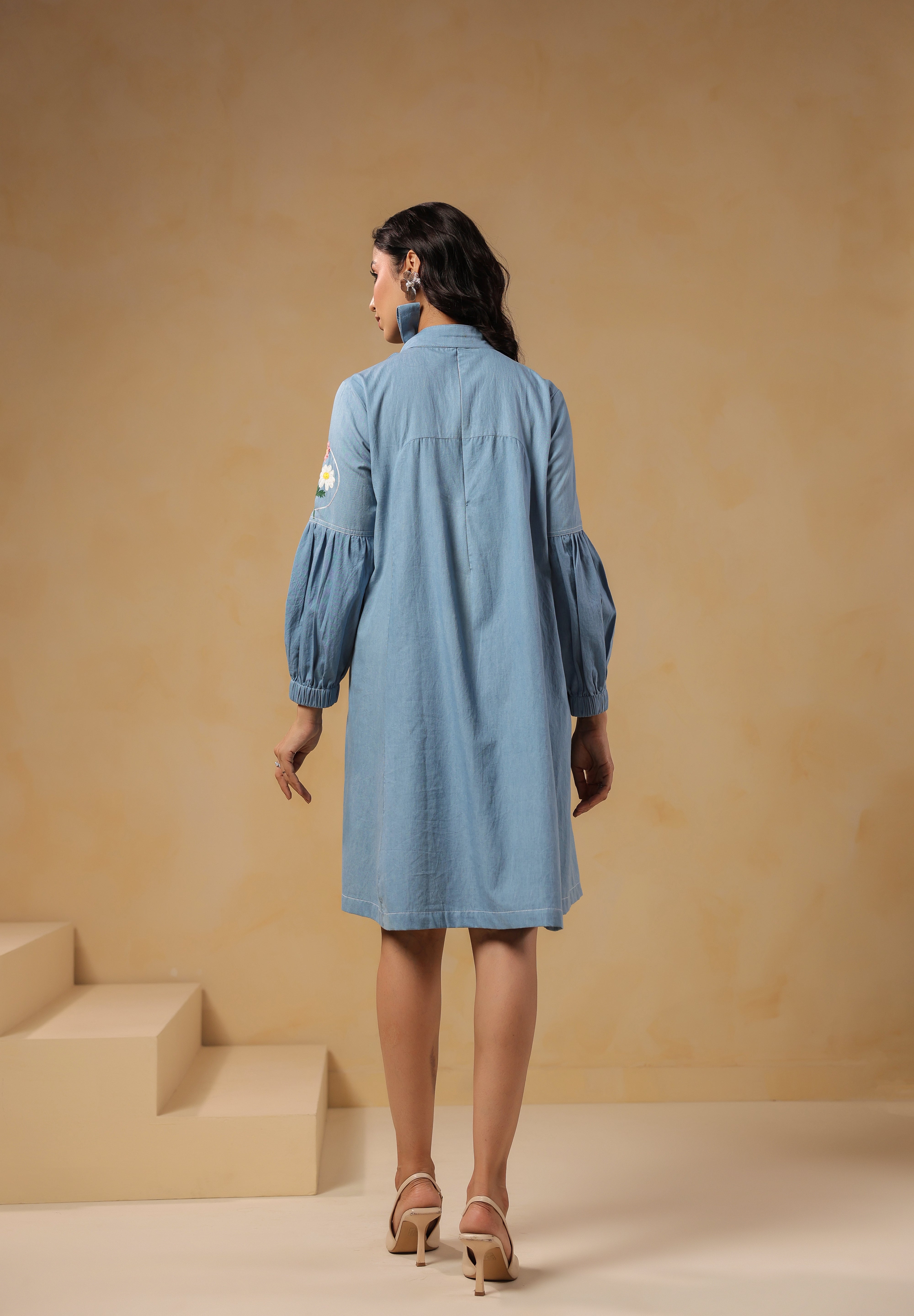 Back view of Floraverse Tie Neck Denim Dress with puff sleeves