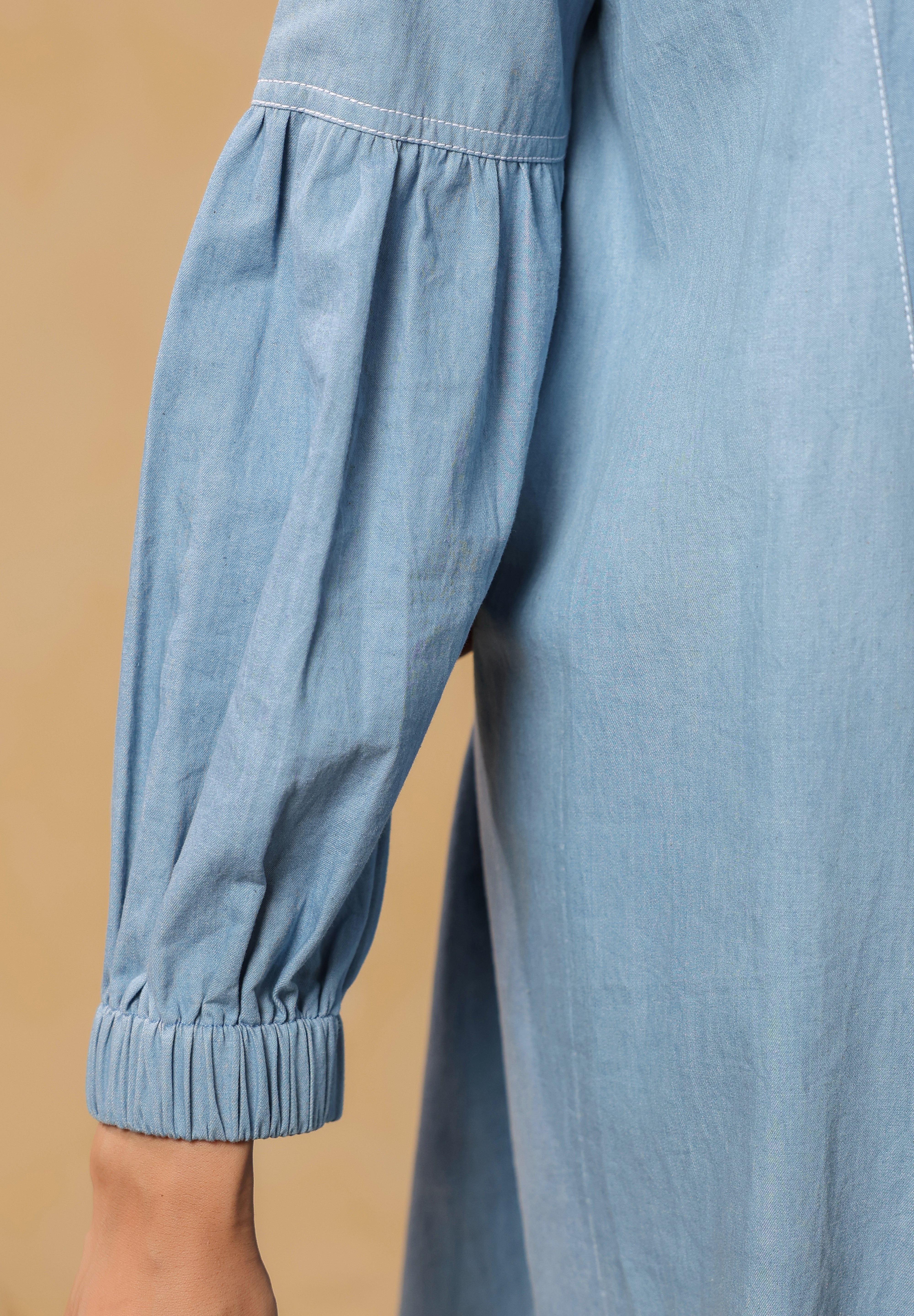 Half-body view highlighting bow-neck and yoke gathers