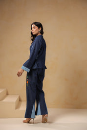 Ridah Geo Flare Coord Set – Back view of denim co-ord with flared trousers and peplum shirt