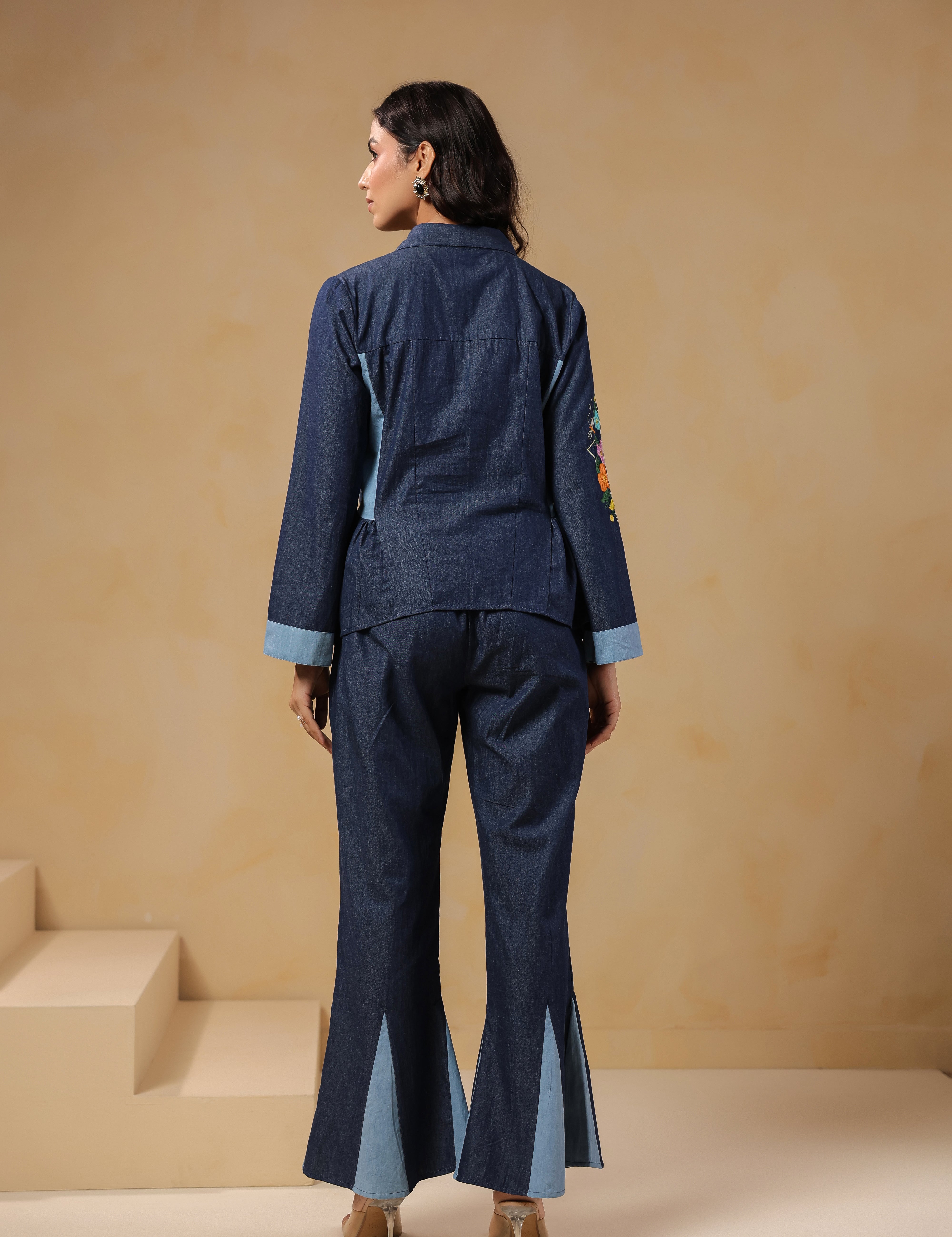 Ridah Geo Flare Coord Set – Back view of denim co-ord with flared trousers and peplum shirt