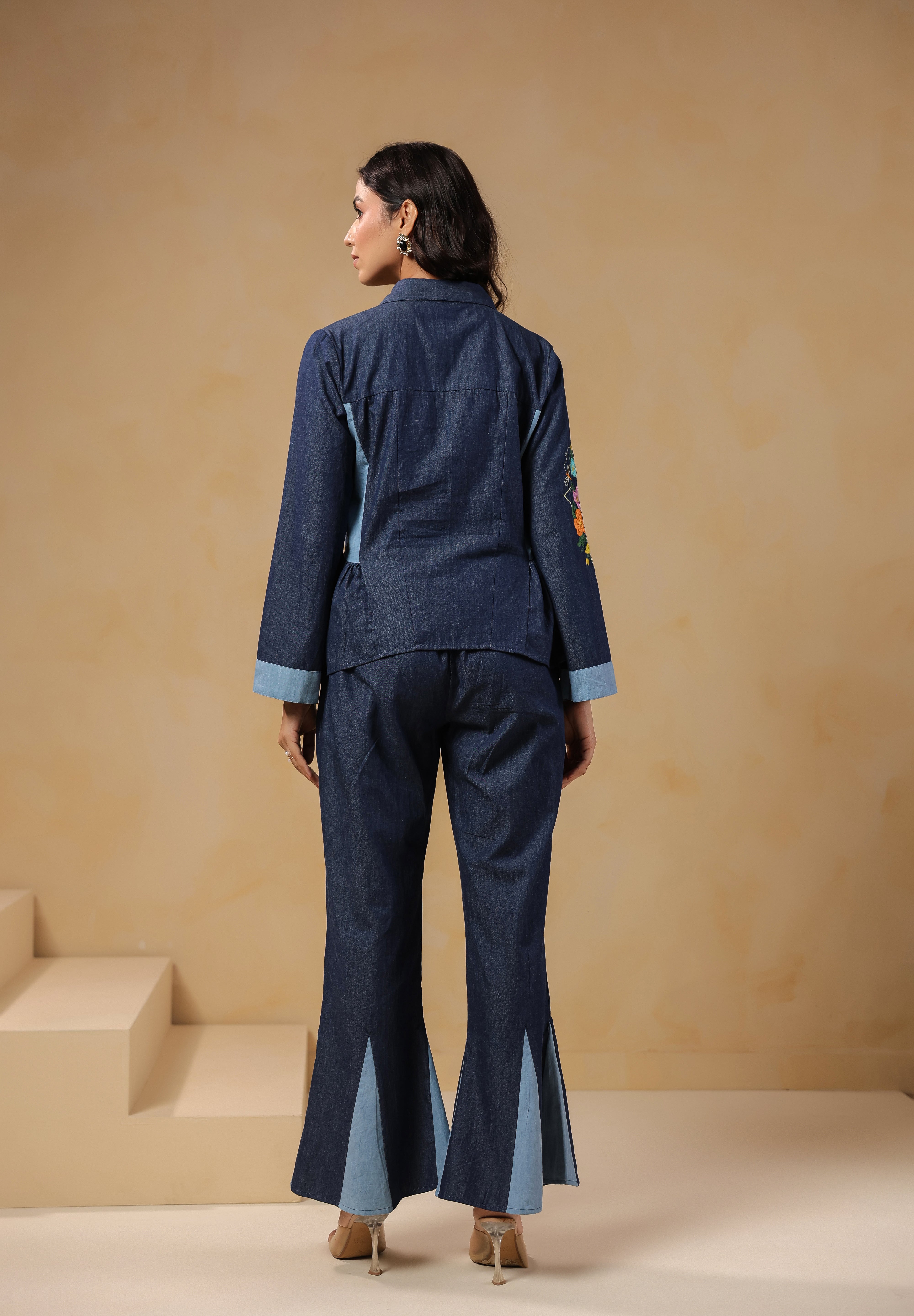Ridah Geo Flare Coord Set – Back view of denim co-ord with flared trousers and peplum shirt
