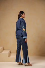 Ridah Geo Flare Coord Set – Back view of denim co-ord with flared trousers and peplum shirt