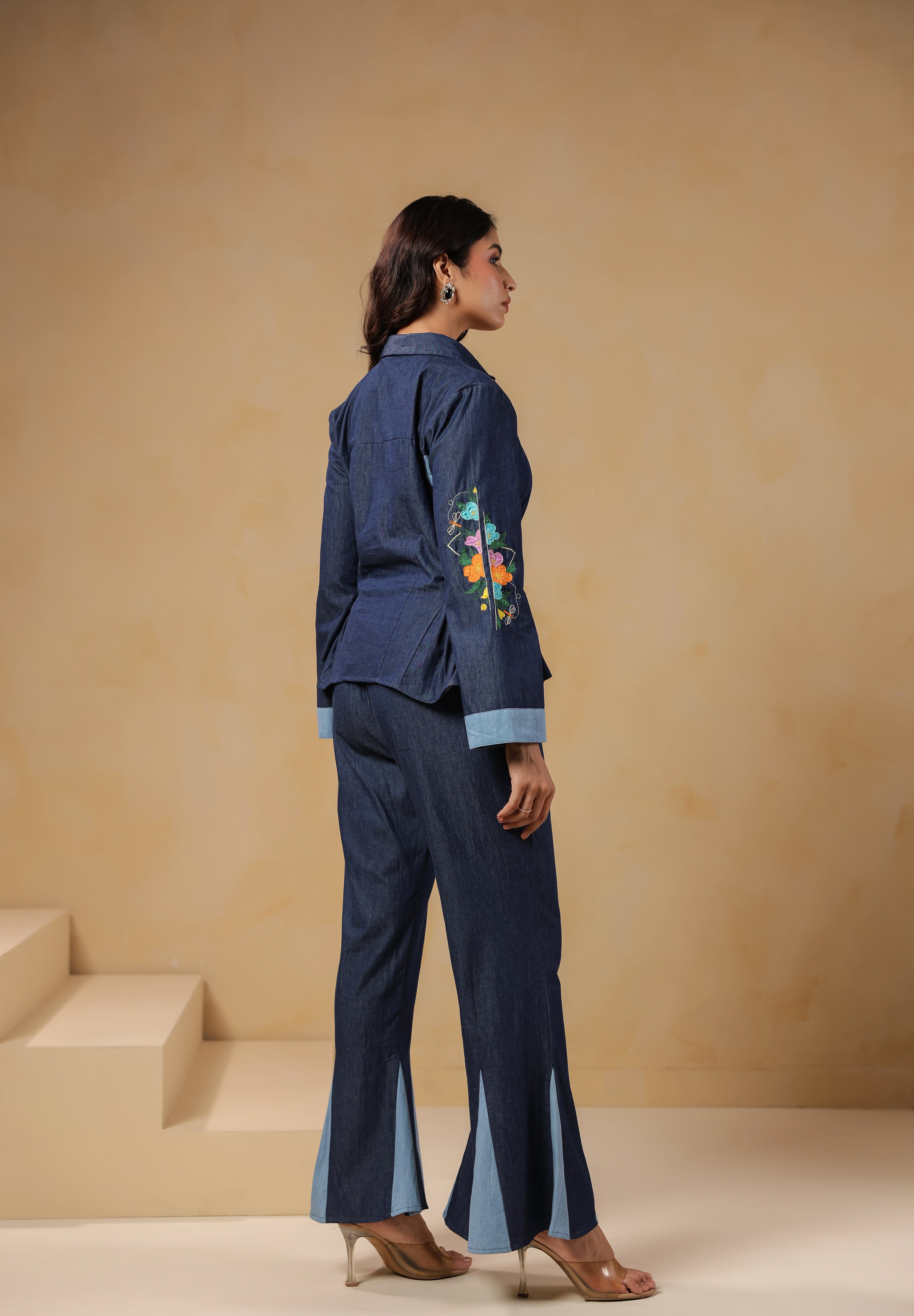 Ridah Geo Flare Coord Set – Back view of denim co-ord with flared trousers and peplum shirt