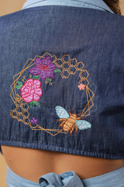 Detailed embroidery on the back of Hexabee Wrap Top with floral and bee accents