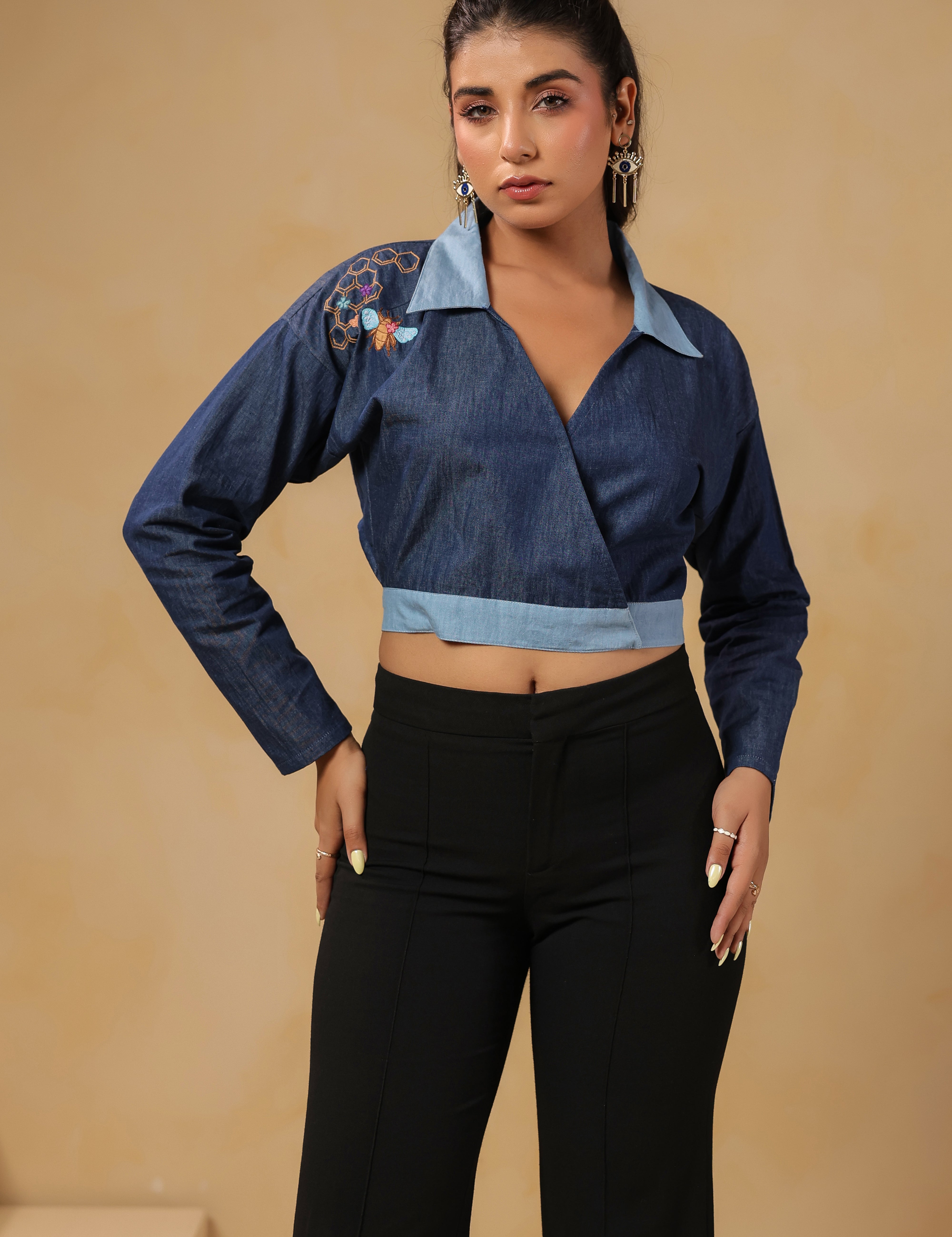 Front view of Hexabee Wrap Top with geometric honeycomb embroidery on shoulder