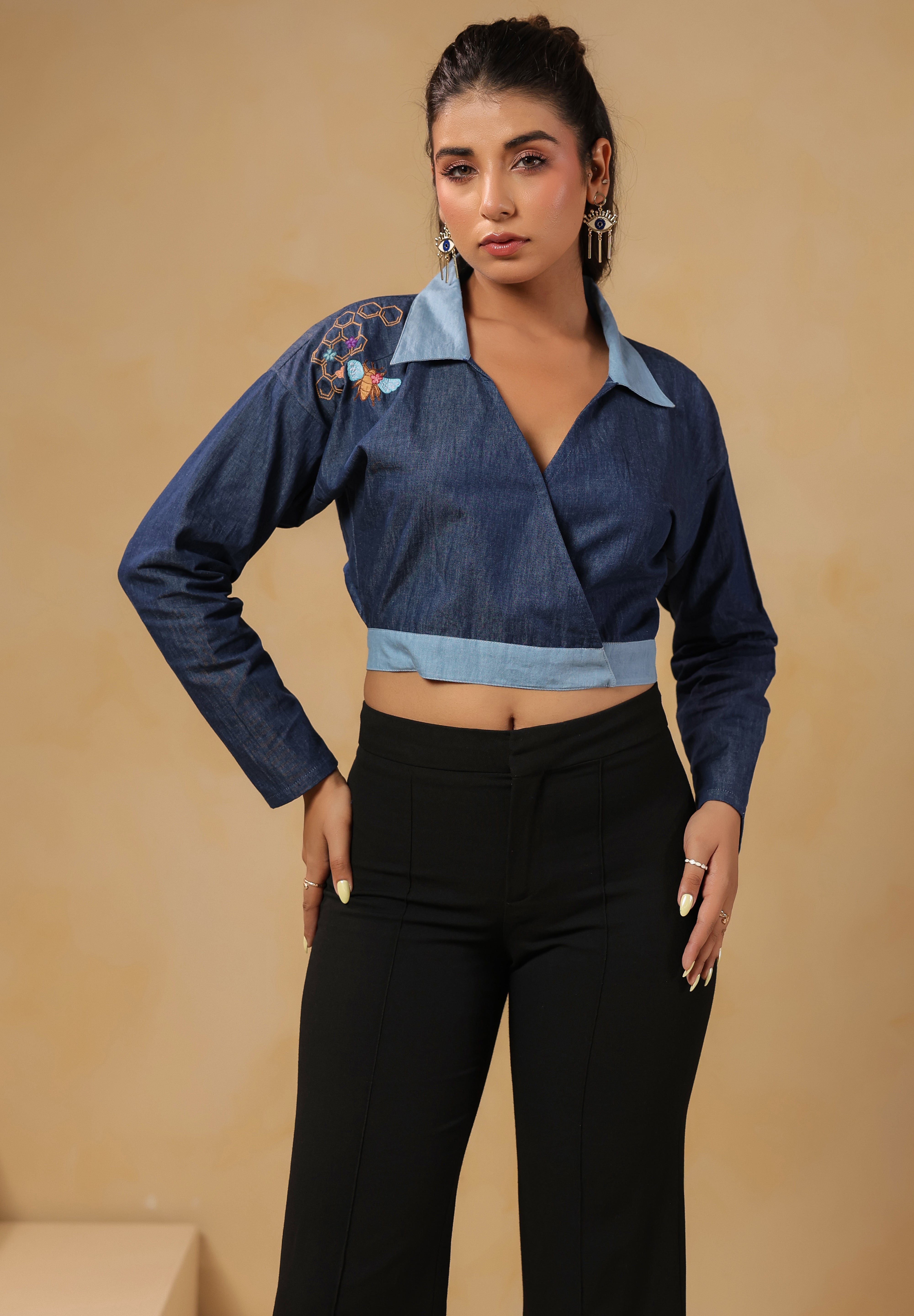Front view of Hexabee Wrap Top with geometric honeycomb embroidery on shoulder