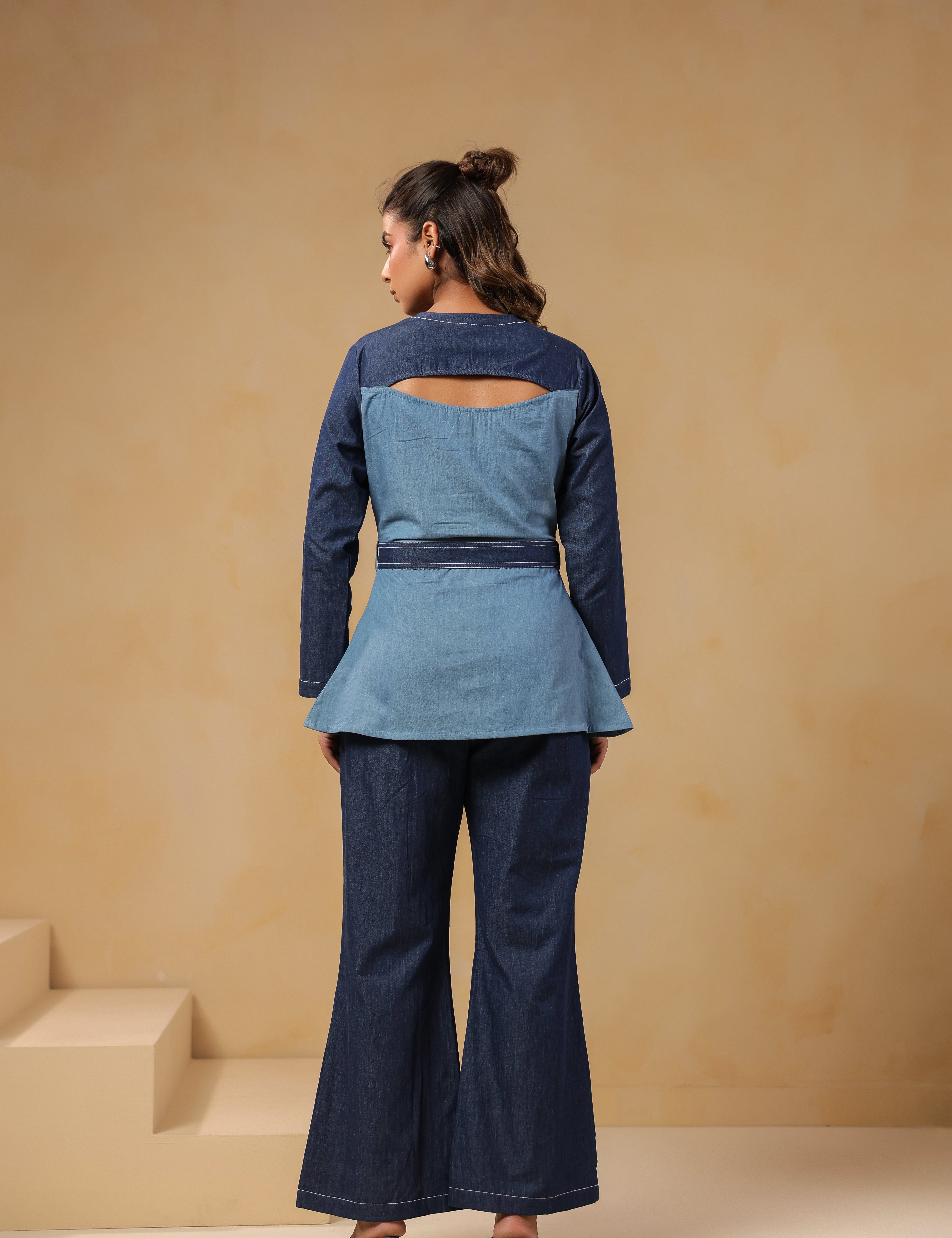 Back view of Ridah's Hummingbloom Coord Set in breathable dual-tone denim featuring a sculpted flare and signature back cutout for modern structure and ease.