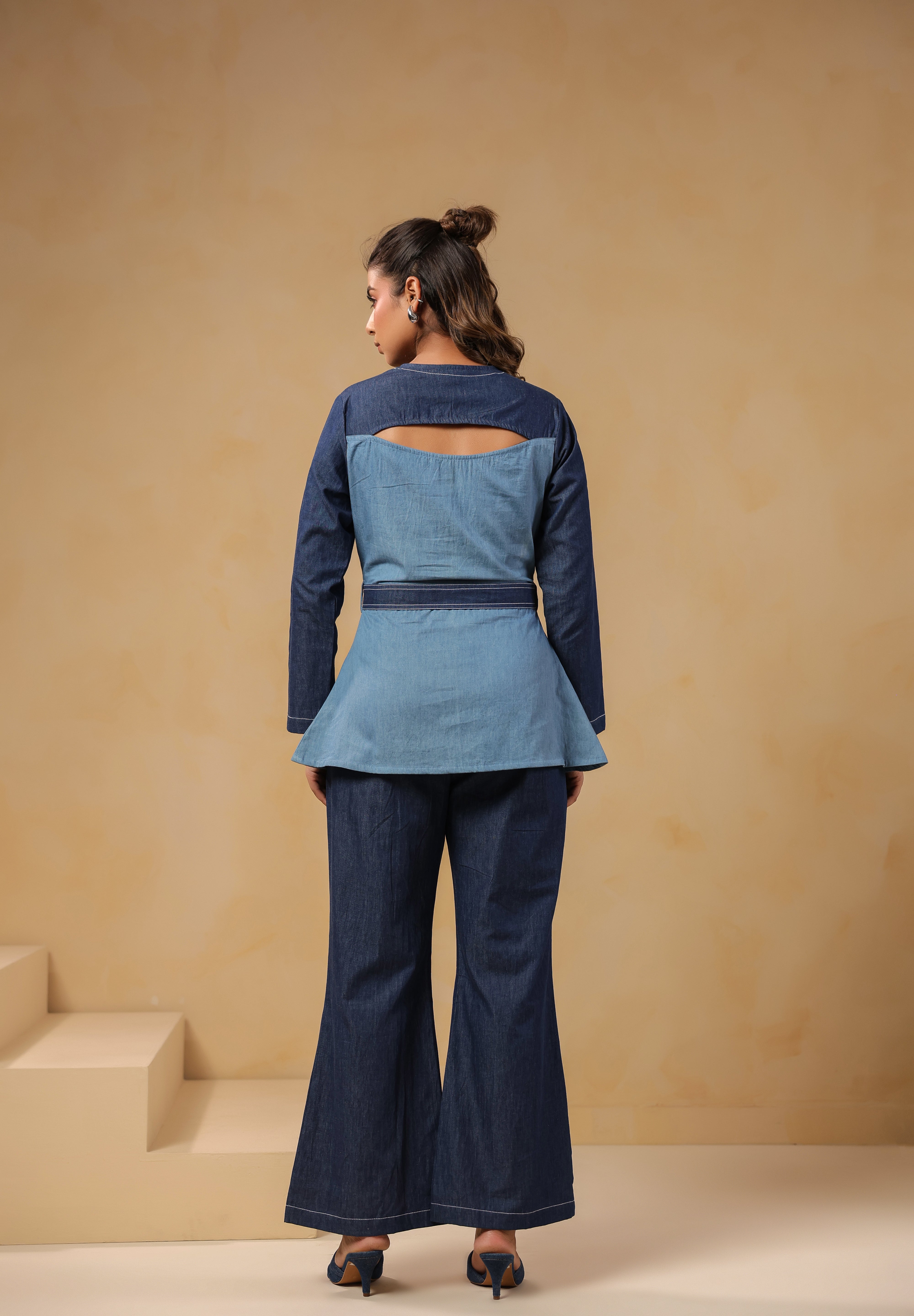 Back view of Ridah's Hummingbloom Coord Set in breathable dual-tone denim featuring a sculpted flare and signature back cutout for modern structure and ease.