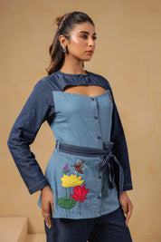 Closeup of tie-belt and handcrafted embroidery on Ridah’s Hummingbloom Coord Set — a visual balance of nature and geometry stitched in denim.