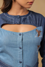 Hummingbird embroidery framed in geometric lines on Ridah’s Hummingbloom top — symbolic of motion, freedom, and modern femininity.
