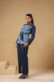 Side pose highlighting Hummingbloom Coord Set's front slit flared pants and embroidered denim top — where comfort meets couture in Ridah’s nature-inspired line.
