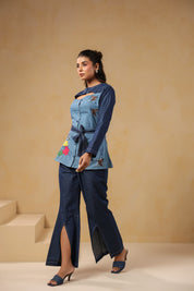 Side pose highlighting Hummingbloom Coord Set's front slit flared pants and embroidered denim top — where comfort meets couture in Ridah’s nature-inspired line.