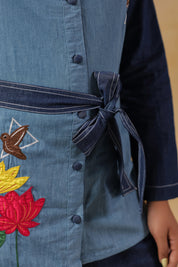 Signature Ridah tilt showcasing the Hummingbloom Coord Set’s fitted silhouette, vibrant embroidery, and versatility for expressive everyday style.