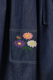 Embroidered daisy trio with pastel butterfly on dark denim pocket — a detail from Ridah’s Meadowflair Coord Set celebrating everyday whimsy.