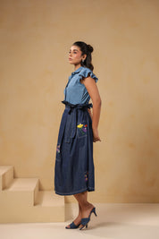 Side profile of Meadowflair Coord Set highlighting the waist-cinching tie-up belt and floral pocket detail on flared denim skirt.