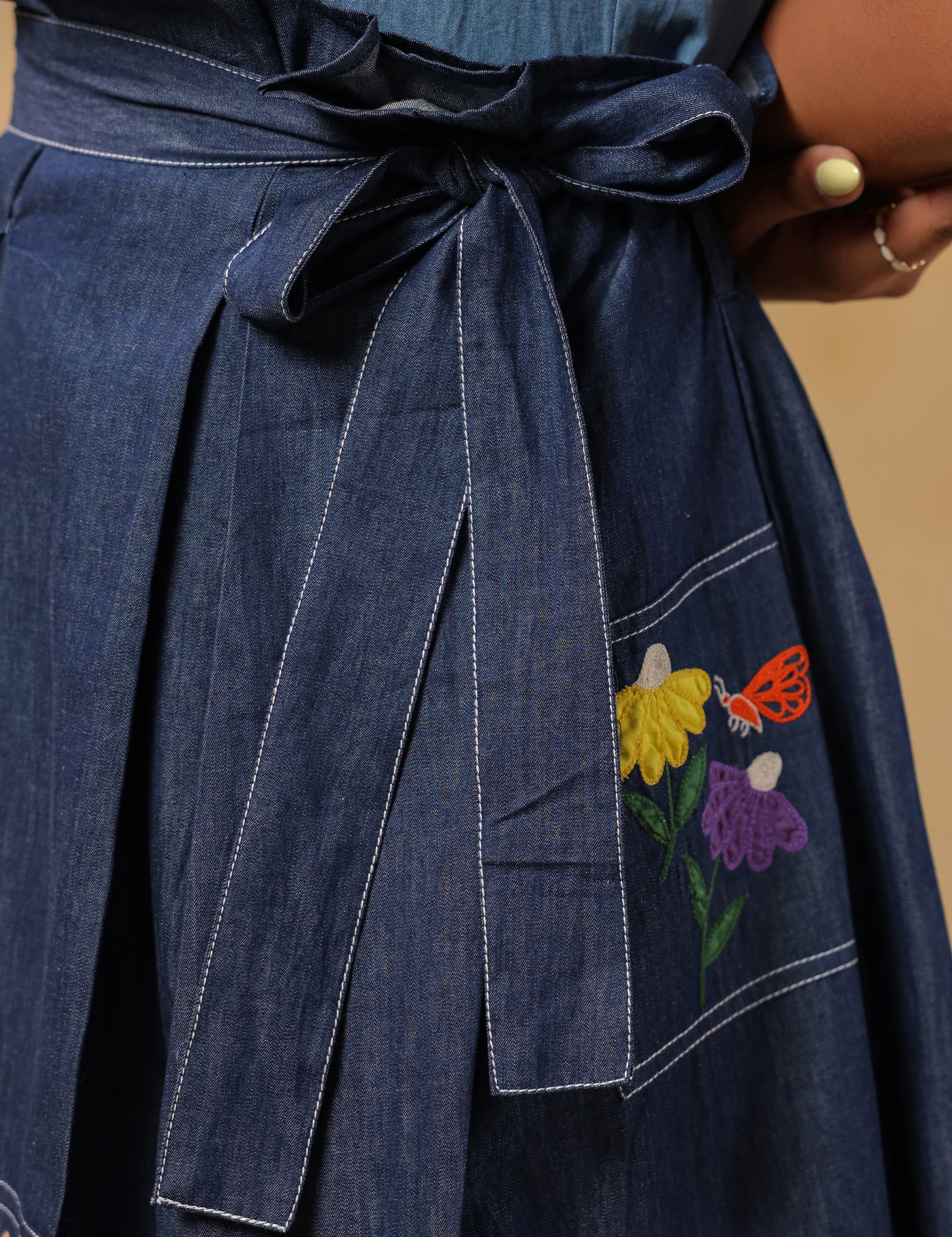 Detailed shot of ruffled waist belt and structured pleats — accentuating the Meadowflair Coord Set’s flattering silhouette.