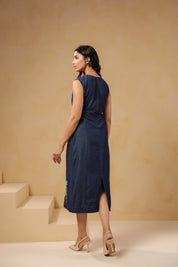 Back view of sleeveless Rectaflora Midi Dress in blue denim.