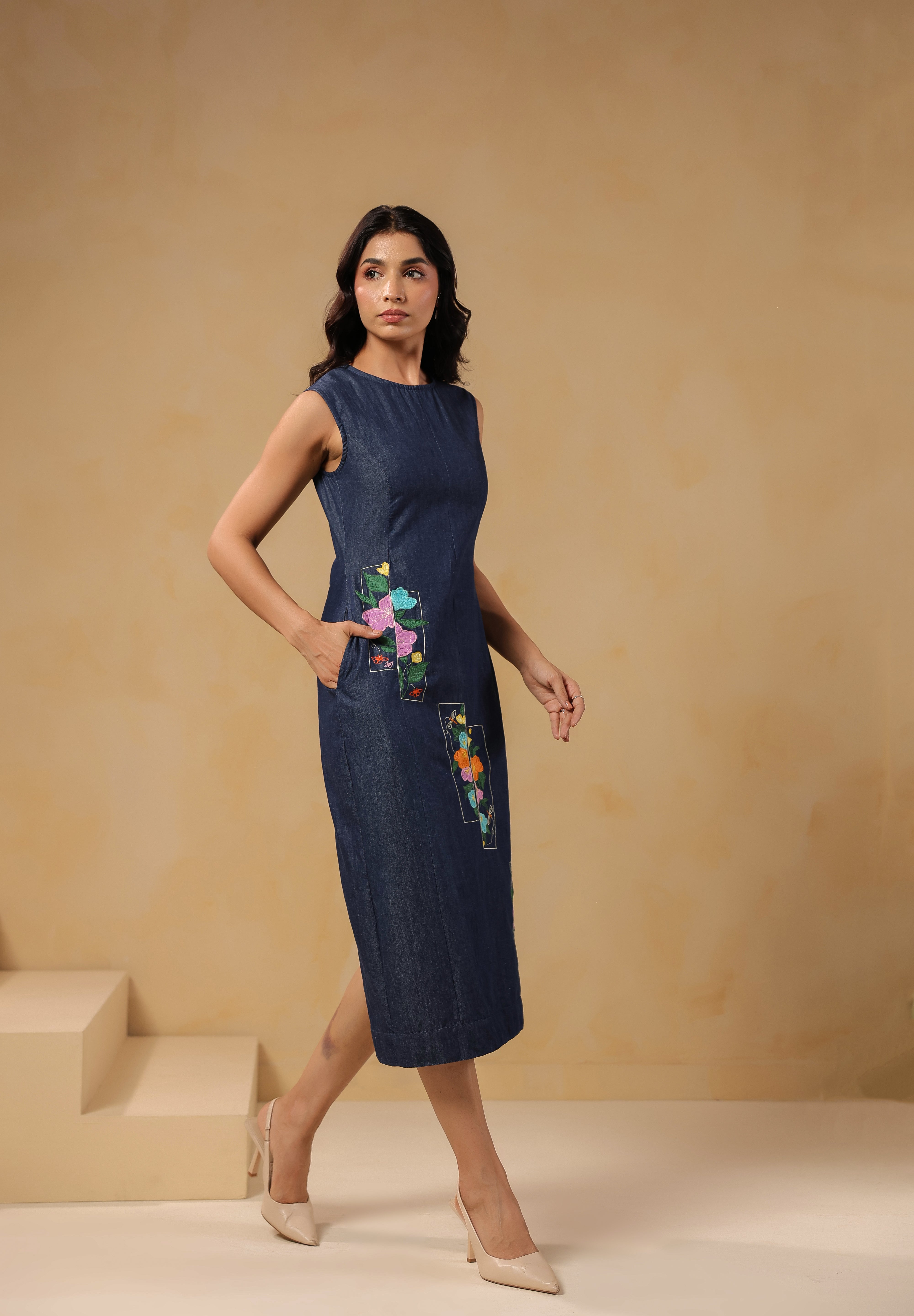 Walking shot of Rectaflora Midi Dress in dark denim.