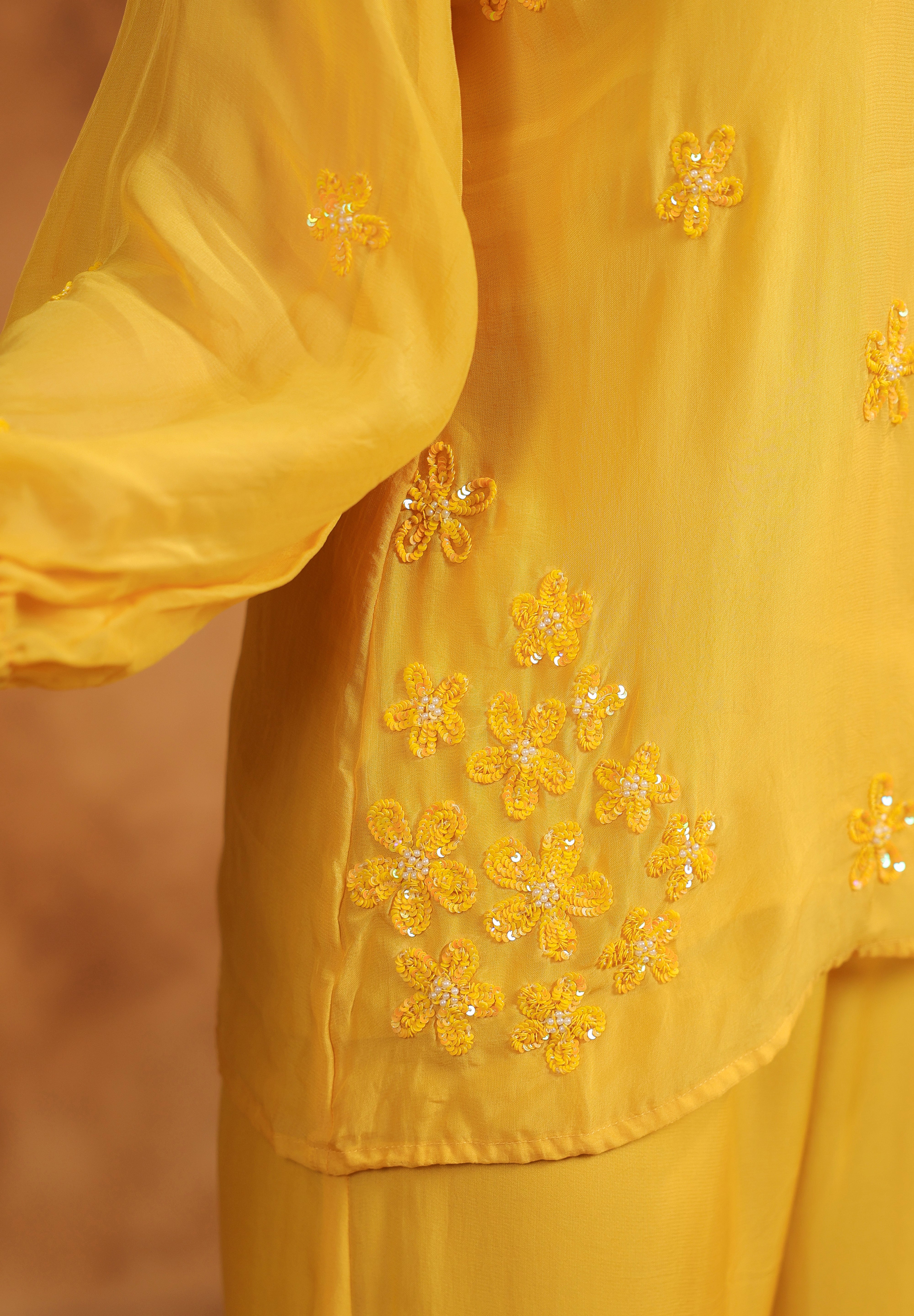 Natural moment showing the lightweight ease and floral accents of the Sunflare Organza Set.