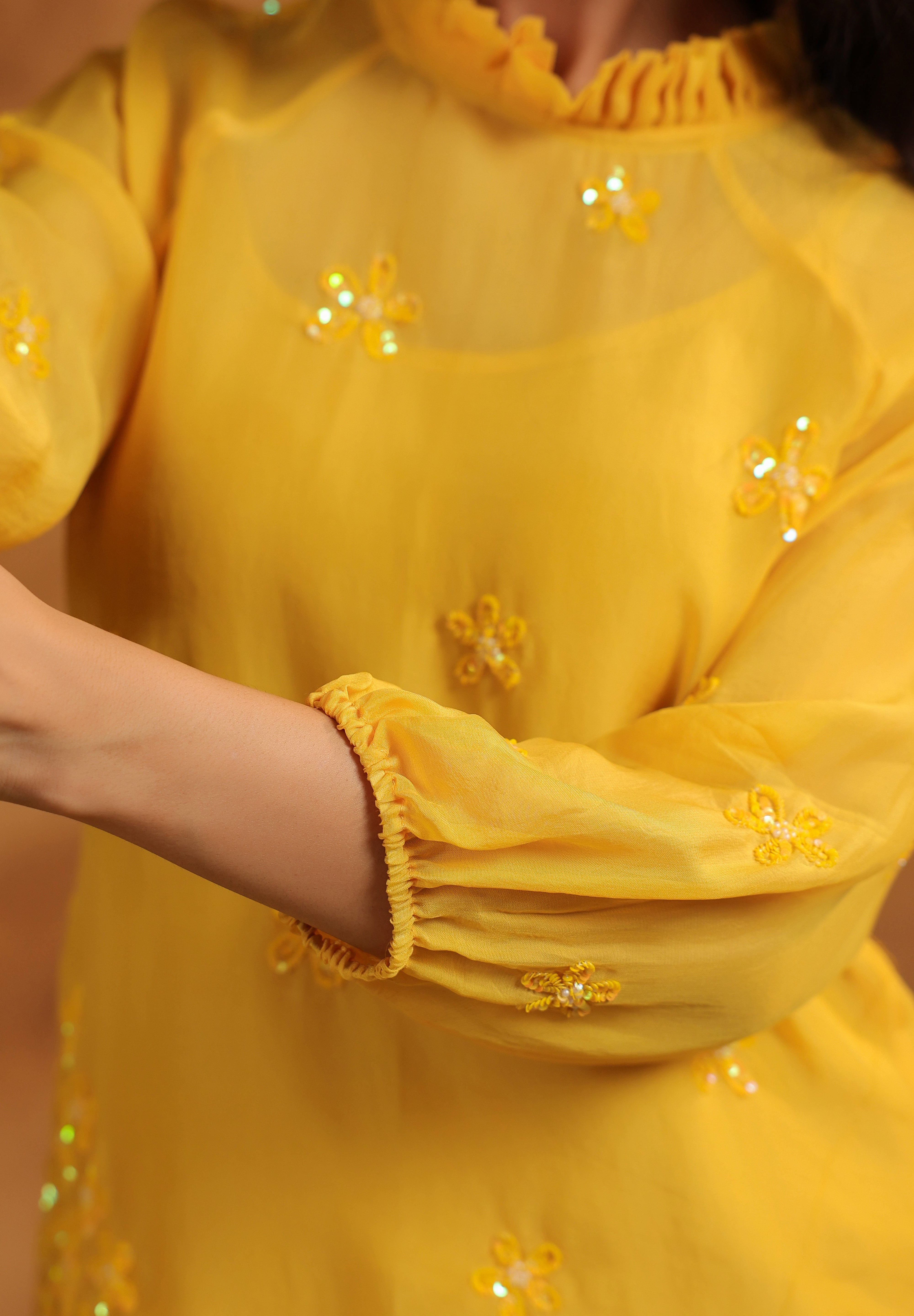 Natural moment showing the lightweight ease and floral accents of the Sunflare Organza Set.