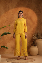 Full-length standing pose showing the elegance and flow of the black embroidered set.