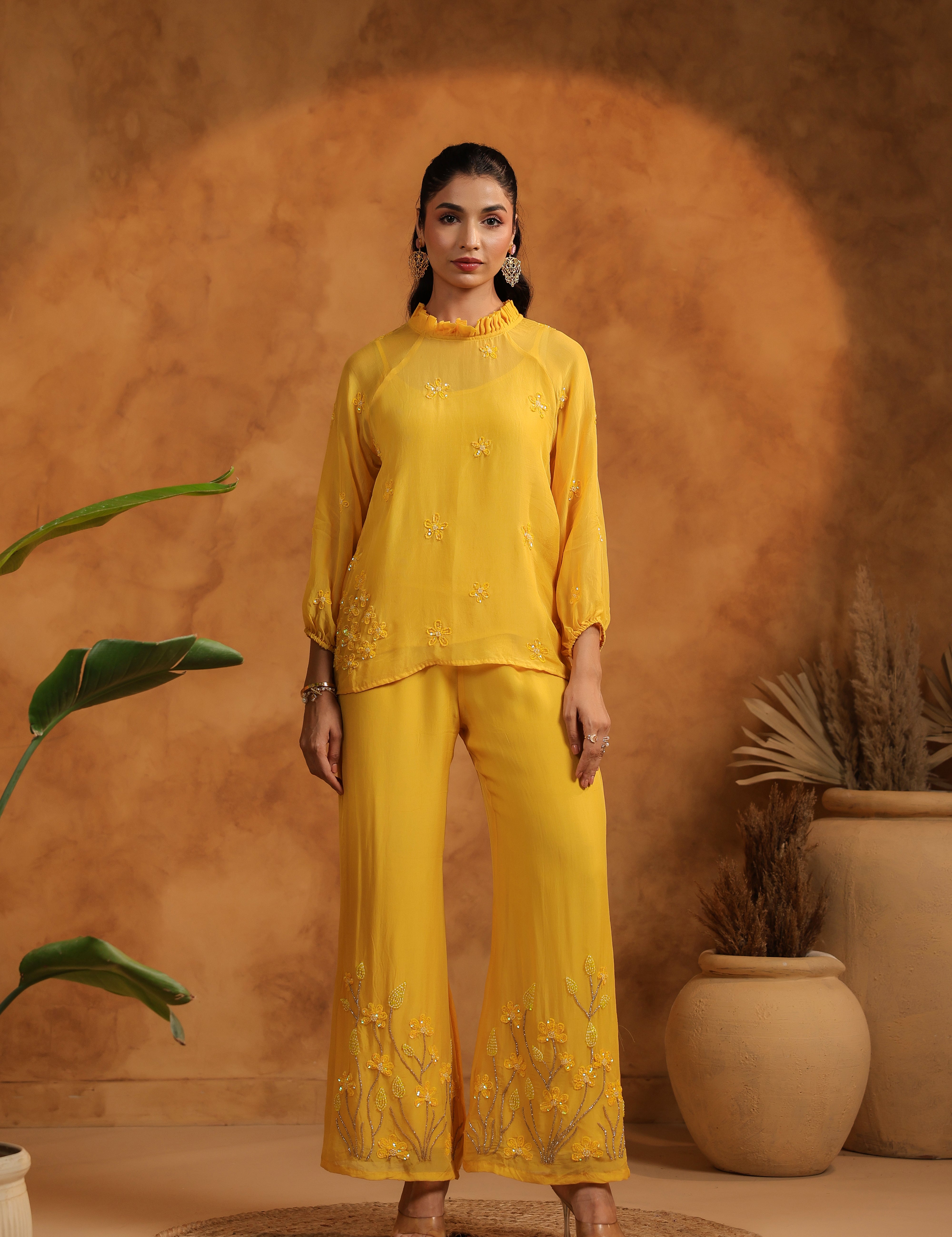 Full-length standing pose showing the elegance and flow of the black embroidered set.