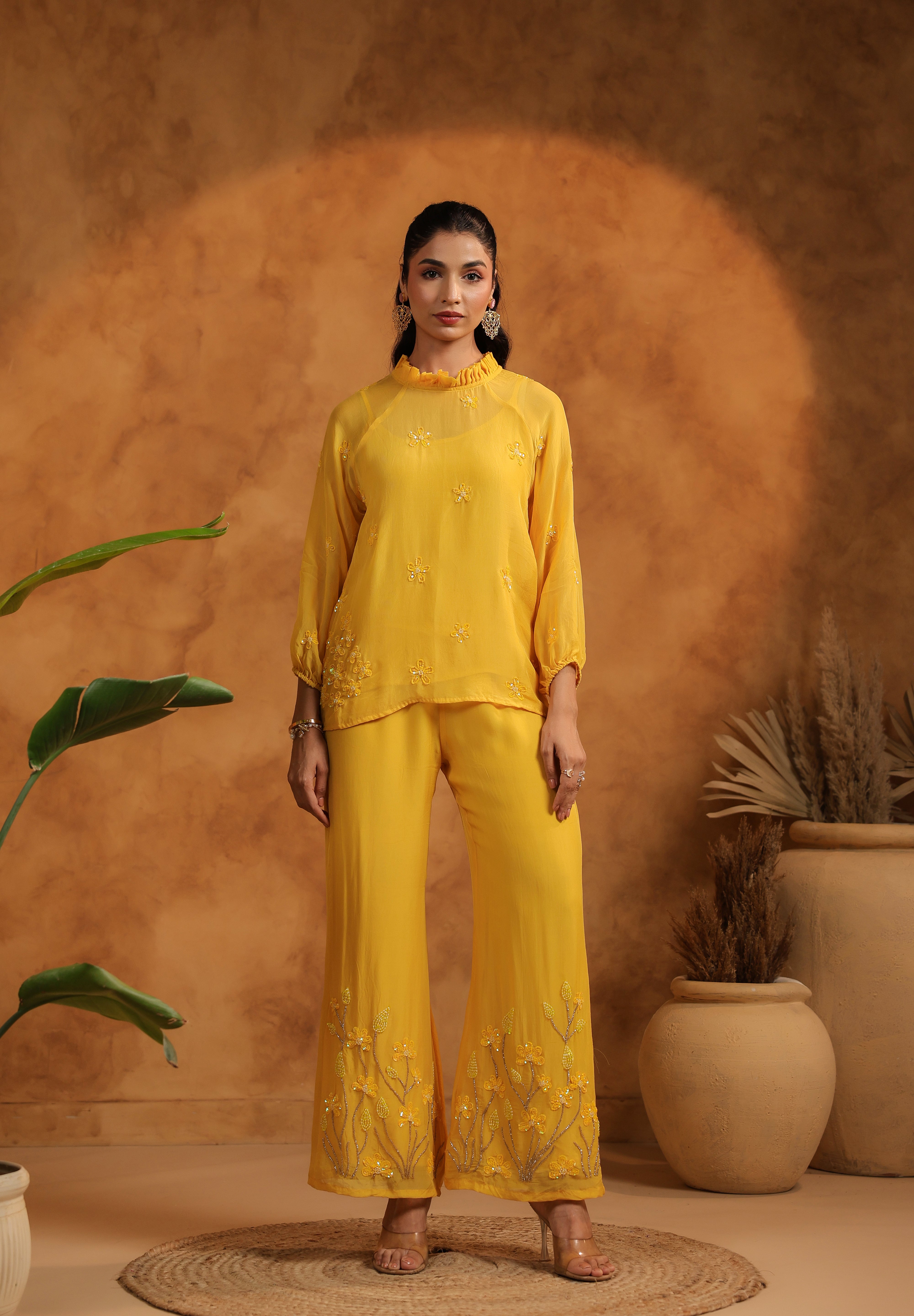 Full-length standing pose showing the elegance and flow of the black embroidered set.