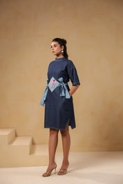 Side profile of Tide & Ties Flamingo Dress with adjustable light denim ties