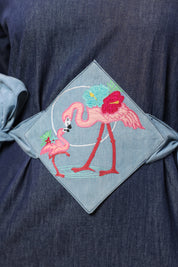 Detailed view of light denim tie belt on Tide & Ties Flamingo Dress