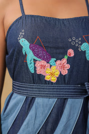 Close-up of turtle and floral embroidery on the bodice of Turtletide Flare Dress with intricate stitching