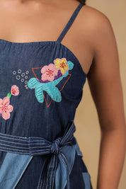 Close-up of turtle and floral embroidery on the bodice of Turtletide Flare Dress with intricate stitching